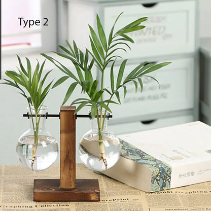 Double Vase tube avec une plante sur une table